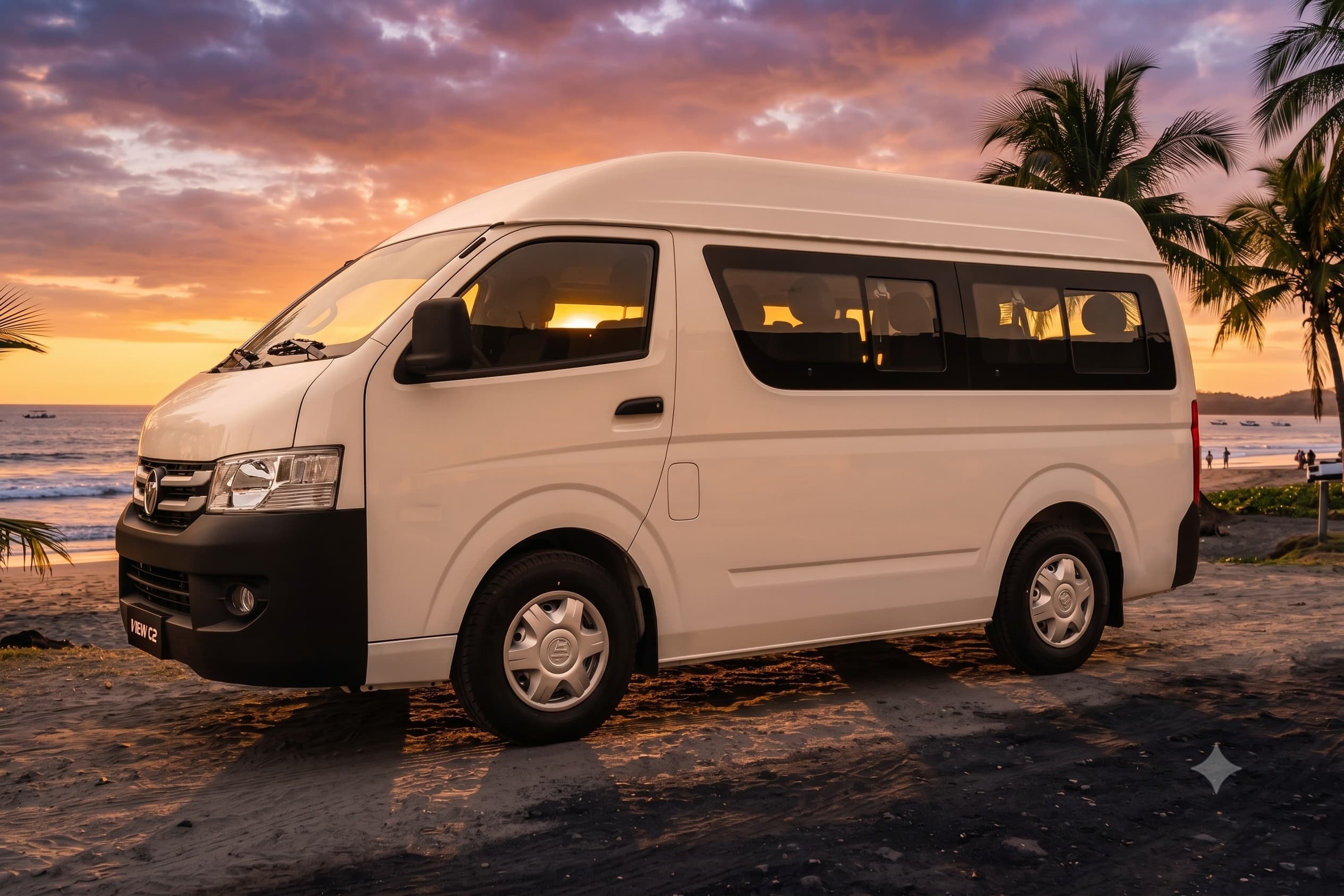 Retana Services Tamarindo passenger van parked on the black sand of a Guanacaste beach at sunset, palm trees and the Pacific behind it
